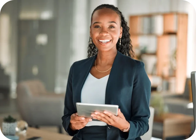 Smiling woman holding tablet in office.