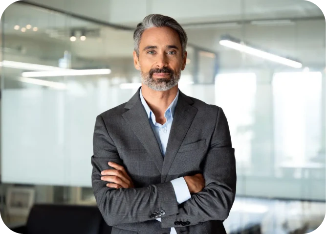 Businessman standing confidently in modern office.